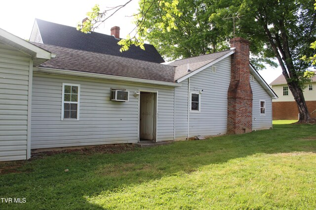 380 Oak Grove Rd, Johnson City, TN 37615 - back of house with roof with shingles, a yard, and a chimney