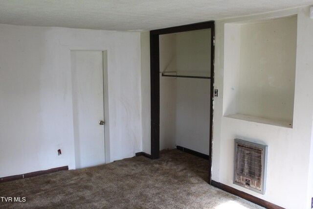 380 Oak Grove Rd, Johnson City, TN 37615 - unfurnished bedroom with heating unit, a closet, carpet floors, a textured ceiling, and baseboards