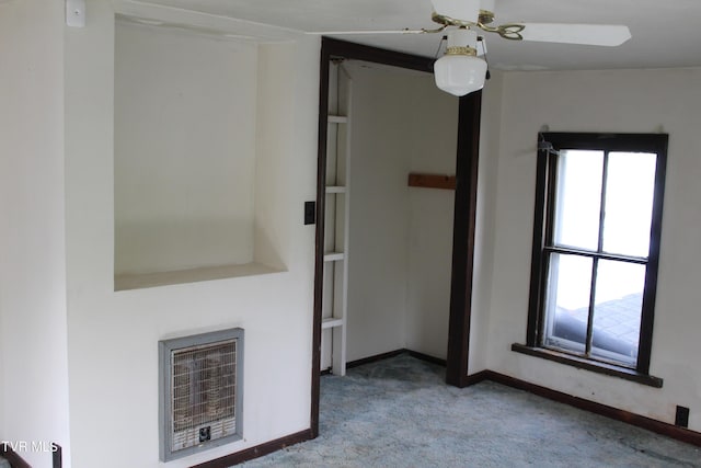 380 Oak Grove Rd, Johnson City, TN 37615 - unfurnished living room with carpet, plenty of natural light, baseboards, and heating unit