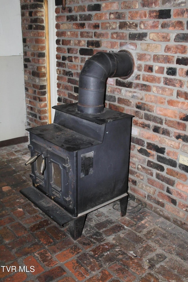 380 Oak Grove Rd, Johnson City, TN 37615 - detailed view of a wood stove and baseboards