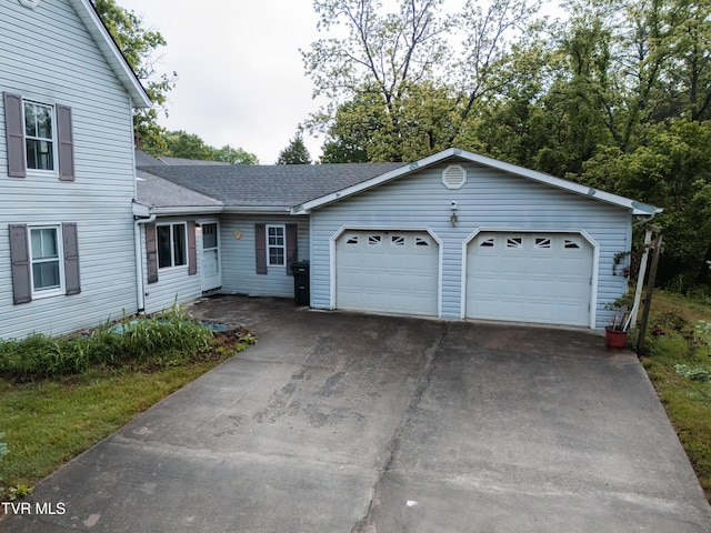 380 Oak Grove Rd, Johnson City, TN 37615 - view of front facade featuring roof with shingles, an attached garage, and driveway