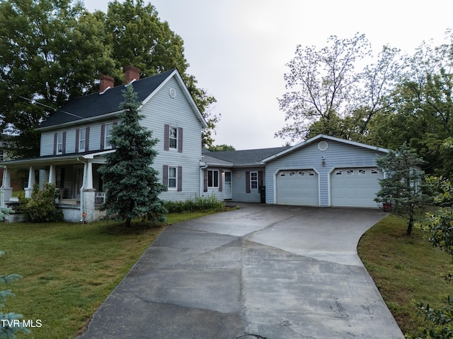 380 Oak Grove Rd, Johnson City, TN 37615 - view of front of house featuring driveway, a garage, a front lawn, a chimney, and a porch
