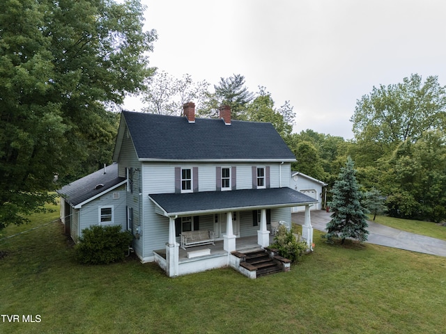 380 Oak Grove Rd, Johnson City, TN 37615 - view of front of house featuring covered porch, a chimney, a front yard, and roof with shingles