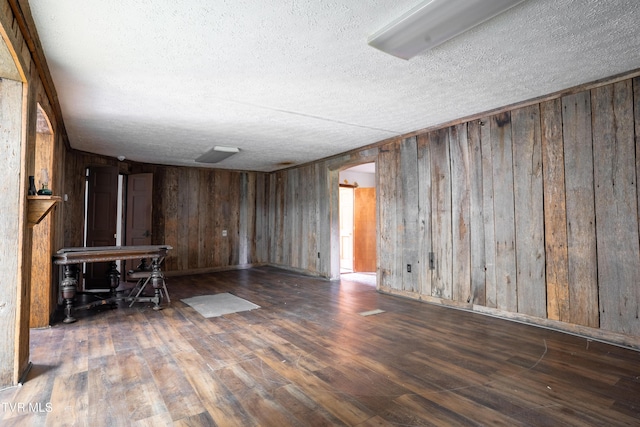 380 Oak Grove Rd, Johnson City, TN 37615 - home office featuring a textured ceiling, wood finished floors, wood walls, and arched walkways