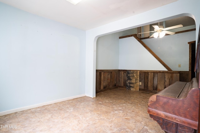380 Oak Grove Rd, Johnson City, TN 37615 - living area with arched walkways, a ceiling fan, and wainscoting