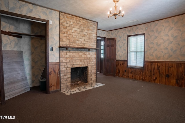 380 Oak Grove Rd, Johnson City, TN 37615 - unfurnished living room with wainscoting, a chandelier, a fireplace, carpet floors, and wallpapered walls