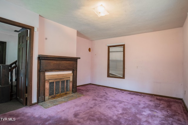380 Oak Grove Rd, Johnson City, TN 37615 - unfurnished living room with a fireplace with flush hearth, carpet, and baseboards