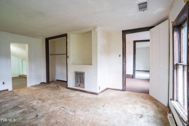 380 Oak Grove Rd, Johnson City, TN 37615 - unfurnished living room featuring carpet, baseboards, a fireplace, and heating unit