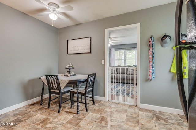 505 Chapman St, Johnson City, TN 37604 - dining room with a ceiling fan, baseboards, and stone finish floors