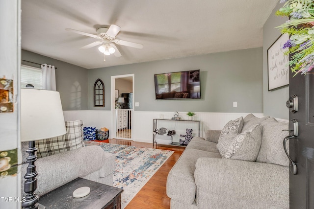 505 Chapman St, Johnson City, TN 37604 - living area with a wainscoted wall, ceiling fan, and wood finished floors
