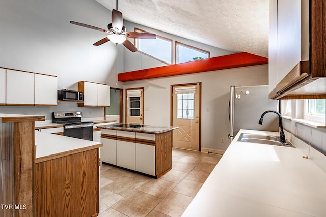 2480 Elk Way, Newport, TN 37821 - kitchen with appliances with stainless steel finishes, a sink, white cabinets, ceiling fan, and high vaulted ceiling
