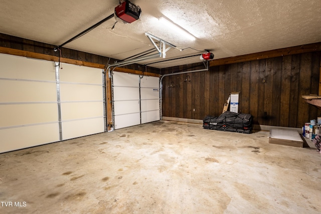 2480 Elk Way, Newport, TN 37821 - garage featuring a garage door opener and wooden walls