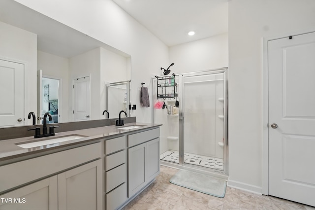 full bath featuring a stall shower and double vanity