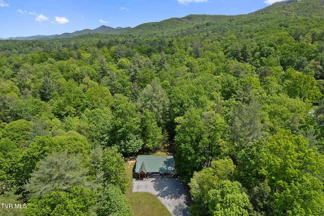 view from above of property with a forest and mountains