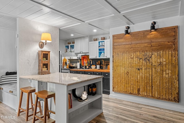 kitchen with open shelves, light wood finished floors, a peninsula, wooden ceiling, and electric stove