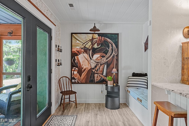 entryway with wood finished floors, baseboards, and wooden ceiling