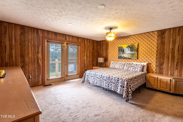 2482-2480 Elk Way, Newport, TN 37821 - bedroom featuring access to outside, carpet flooring, a textured ceiling, and wooden walls