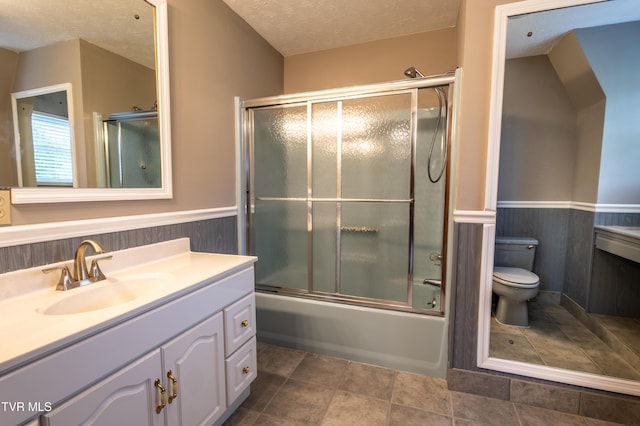 2482-2480 Elk Way, Newport, TN 37821 - bathroom with toilet, wainscoting, vanity, a textured ceiling, and bath / shower combo with glass door