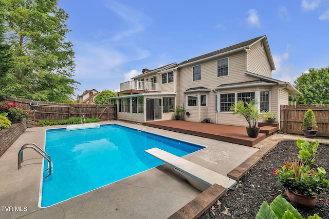 20111 Galen Dr, Abingdon, VA 24211 - view of swimming pool featuring a deck, a fenced backyard, a diving board, and a sunroom