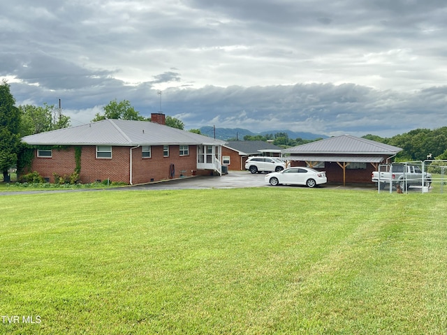 457 Devault St, Church Hill, TN 37642 - back of property with a chimney, brick siding, a yard, and a mountain view