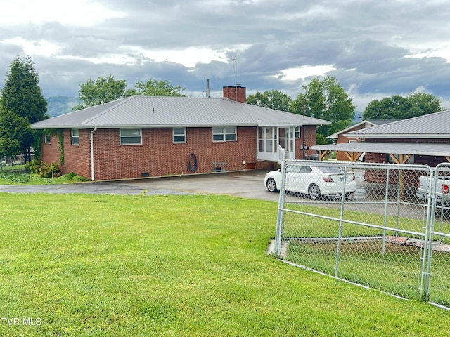 457 Devault St, Church Hill, TN 37642 - rear view of property featuring a chimney, brick siding, and driveway
