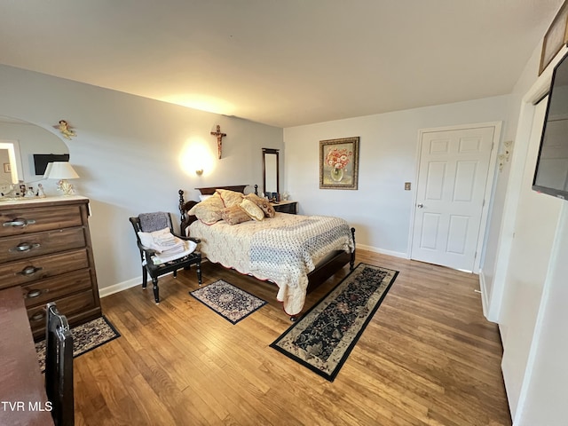 457 Devault St, Church Hill, TN 37642 - bedroom with wood finished floors, baseboards, and arched walkways