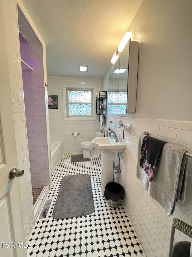 457 Devault St, Church Hill, TN 37642 - full bath with tile walls, tiled shower, tile patterned flooring, toilet, and a bath