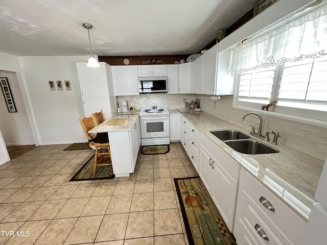 457 Devault St, Church Hill, TN 37642 - kitchen featuring white appliances, a sink, decorative backsplash, and light countertops