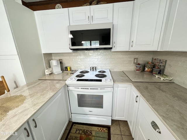 457 Devault St, Church Hill, TN 37642 - kitchen with white electric stove, tasteful backsplash, white cabinets, and dark tile patterned floors