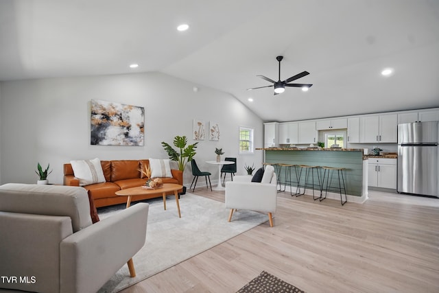 1225 Bristol View Dr, Bristol, VA 24201 - living room featuring lofted ceiling, light wood-style flooring, recessed lighting, ceiling fan, and baseboards
