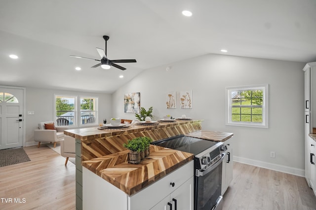 1225 Bristol View Dr, Bristol, VA 24201 - kitchen with electric range, wood counters, a ceiling fan, light wood-style flooring, and recessed lighting