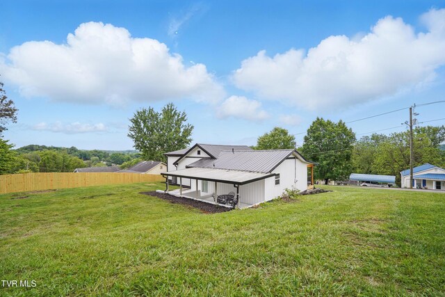 1225 Bristol View Dr, Bristol, VA 24201 - view of home's exterior with metal roof and a patio area