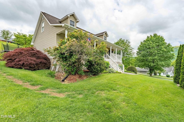 522 Crook St, Hampton, TN 37658 - view of side of home featuring a yard, covered porch, and stairway