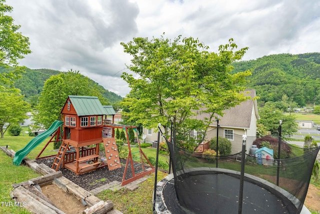 522 Crook St, Hampton, TN 37658 - view of playground featuring a trampoline, a yard, a mountain view, and a view of trees