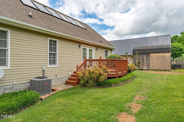 522 Crook St, Hampton, TN 37658 - rear view of property featuring a storage shed, central AC unit, a wooden deck, an outdoor structure, and a lawn