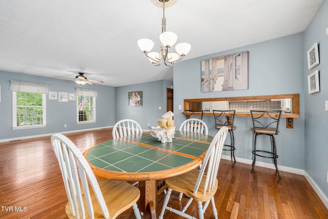 522 Crook St, Hampton, TN 37658 - dining room featuring a chandelier, hardwood / wood-style flooring, baseboards, and ceiling fan