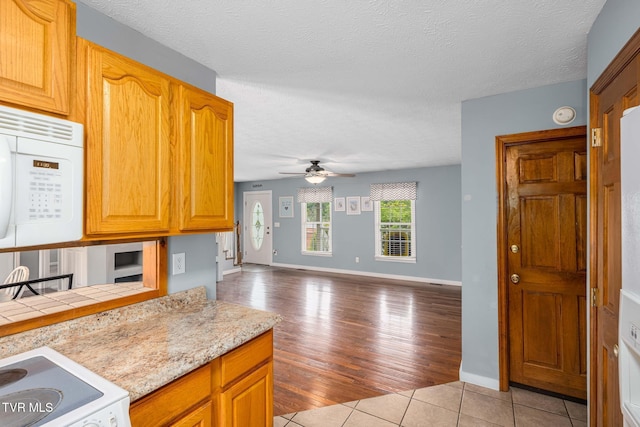 522 Crook St, Hampton, TN 37658 - kitchen with white appliances, light countertops, ceiling fan, open floor plan, and baseboards