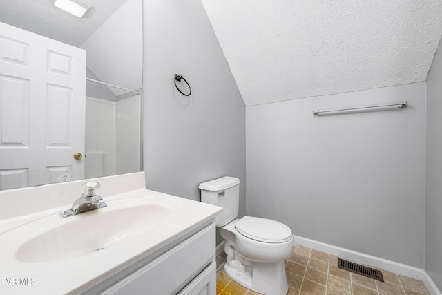 522 Crook St, Hampton, TN 37658 - full bath with vaulted ceiling, vanity, toilet, baseboards, and a textured ceiling