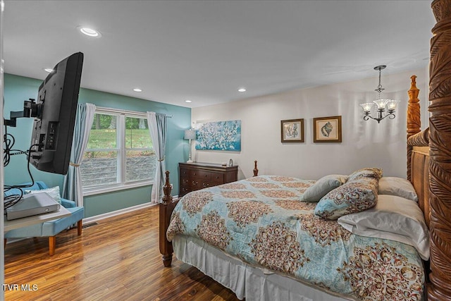 bedroom featuring wood finished floors, a chandelier, baseboards, and recessed lighting