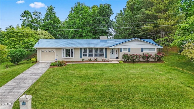 ranch-style home with a garage, a chimney, metal roof, and a front yard