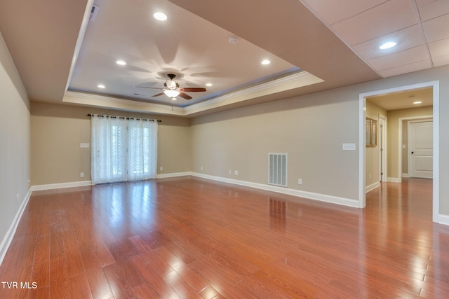 1001 Willows Trace Dr, Johnson City, TN 37601 - unfurnished room featuring a tray ceiling, crown molding, ceiling fan, baseboards, and wood finished floors