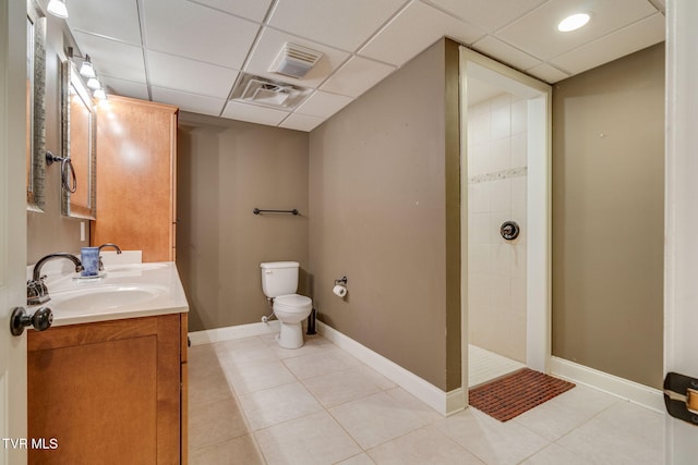 1001 Willows Trace Dr, Johnson City, TN 37601 - full bath with double vanity, toilet, tiled shower, tile patterned floors, and a paneled ceiling