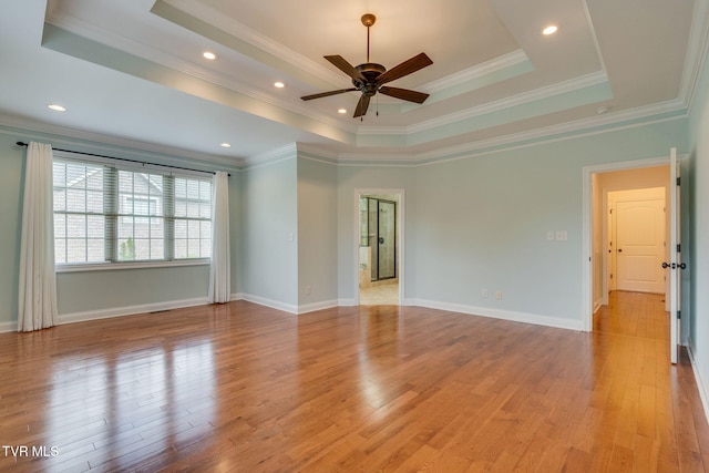 1001 Willows Trace Dr, Johnson City, TN 37601 - unfurnished room with a tray ceiling, ceiling fan, light wood-style floors, ornamental molding, and baseboards
