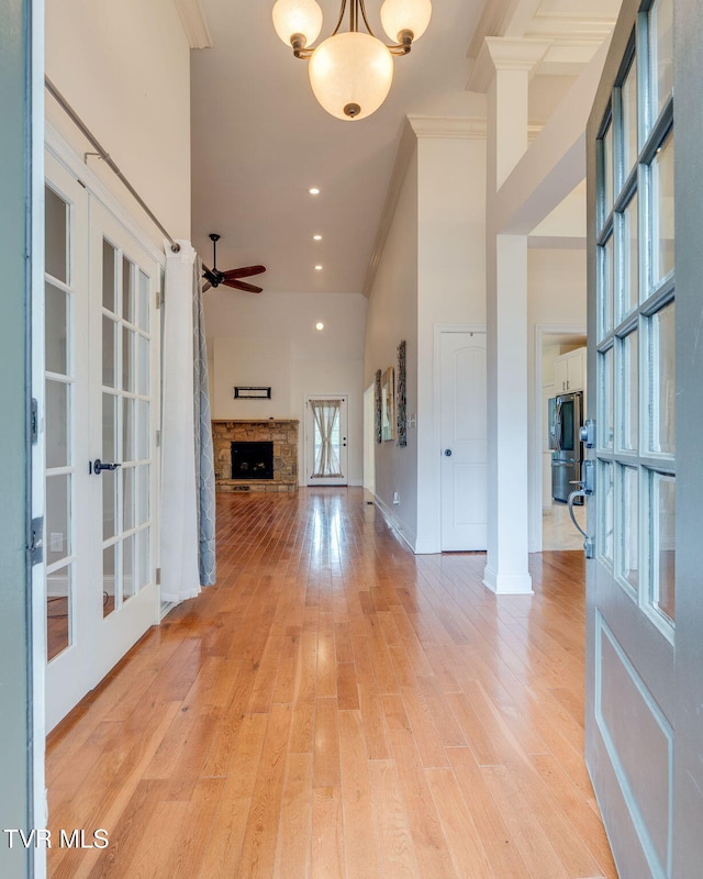 1001 Willows Trace Dr, Johnson City, TN 37601 - foyer entrance featuring crown molding, french doors, a stone fireplace, light wood finished floors, and ceiling fan