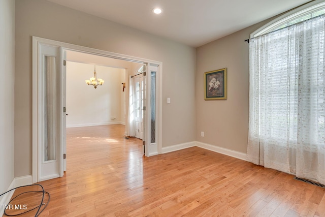 1001 Willows Trace Dr, Johnson City, TN 37601 - spare room with a chandelier, light wood-type flooring, baseboards, and recessed lighting
