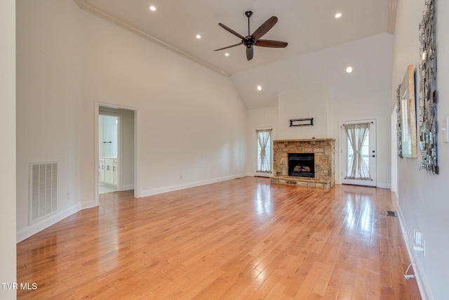 1001 Willows Trace Dr, Johnson City, TN 37601 - unfurnished living room featuring a ceiling fan, high vaulted ceiling, a stone fireplace, light wood finished floors, and recessed lighting