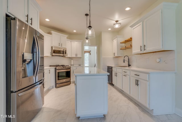 1001 Willows Trace Dr, Johnson City, TN 37601 - kitchen with stainless steel appliances, open shelves, a sink, light countertops, and a kitchen island