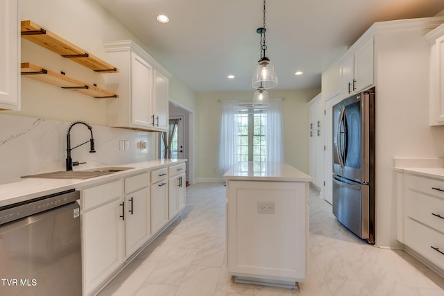 1001 Willows Trace Dr, Johnson City, TN 37601 - kitchen with appliances with stainless steel finishes, a center island, light marble finish floors, open shelves, and a sink
