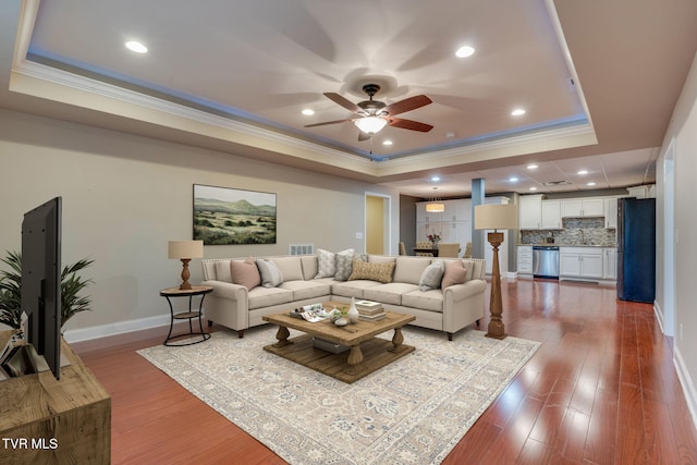 1001 Willows Trace Dr, Johnson City, TN 37601 - living room featuring a tray ceiling, crown molding, ceiling fan, baseboards, and wood finished floors