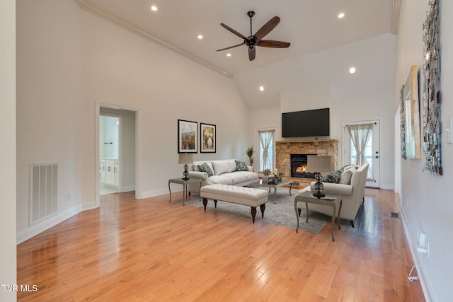1001 Willows Trace Dr, Johnson City, TN 37601 - living area featuring high vaulted ceiling, a stone fireplace, a ceiling fan, light wood-style floors, and recessed lighting